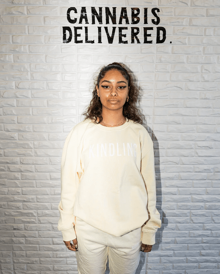 Woman wearing a Cream Crew Neck Sweatshirt